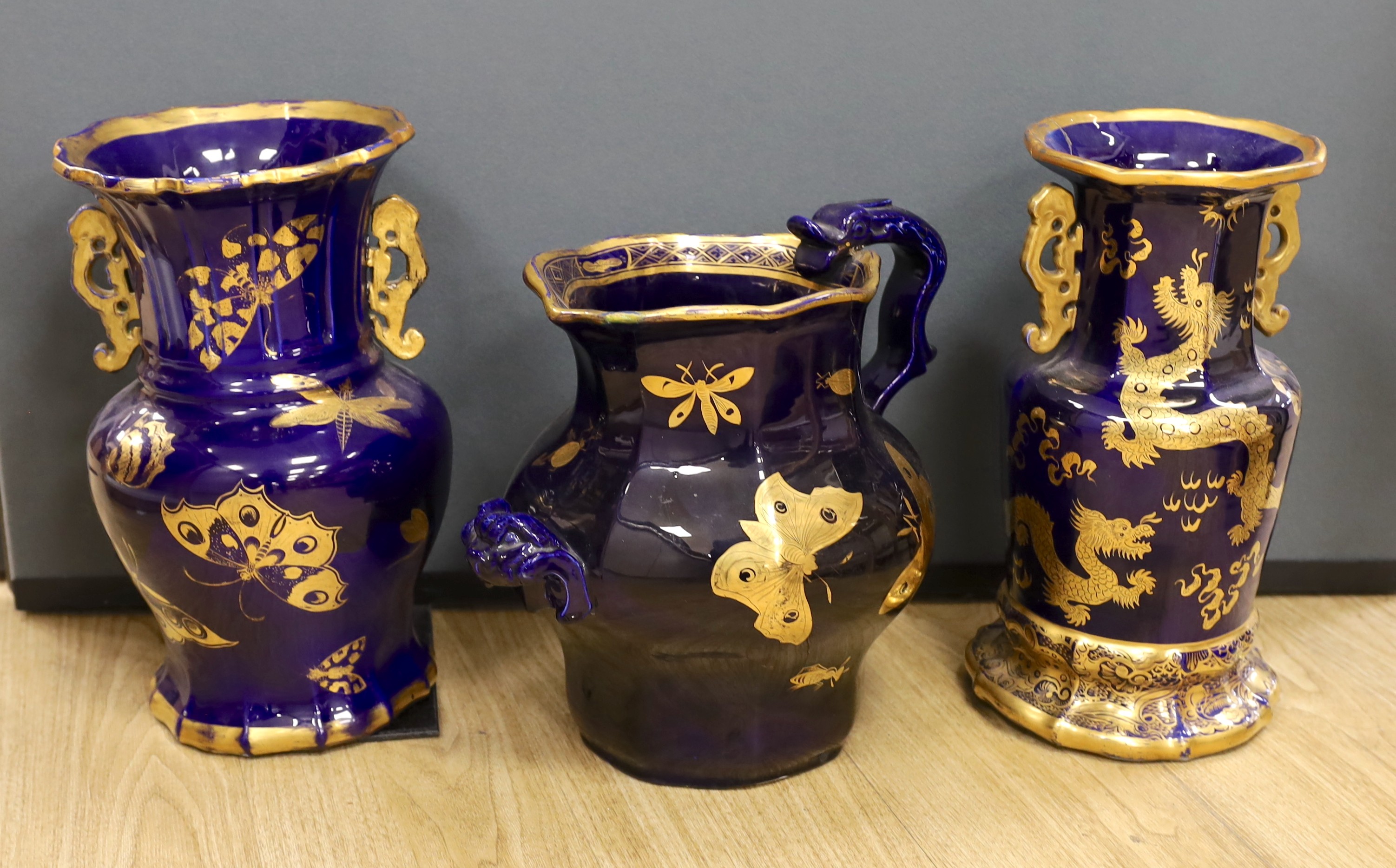 A large early 19th century Masons ironstone cobalt blue and gilt decorated jug and two similar large vases, tallest 37cms high